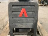 a picture of a forklift sitting on a pallet in a warehouse