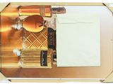 a bottle of perfume sitting on top of a mirror