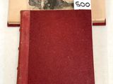 un livre rouge sur lequel figure l'image d'un homme et d'une femme