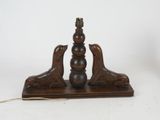 an image of a wooden table lamp with two birds on it
