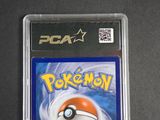 pokemon trading card in plastic case on a black surface