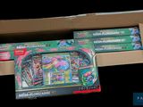 a box of pokemon cards and a box of other items