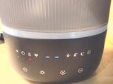 an image of a black and white speaker sitting on a table