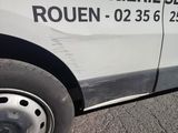 a van that has been vandalized with a sticker on it