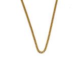 gros plan d'un collier en chaîne en or sur fond blanc