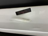 a sticker on the hood of a white car