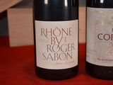 two bottles of wine that are sitting on a table