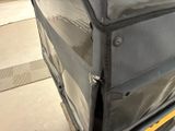 a luggage bag sitting on the back of a truck