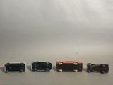 five miniature cars that are lined up in a row