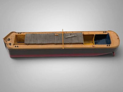 a model of a boat on a gray surface