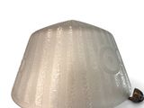 a lamp that is sitting on a white surface