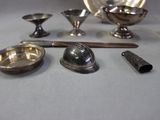 a lot of silver objects that are on the table