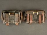 pair of leather tool bags on grey background