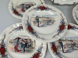 four plates with pictures of people on them on a table