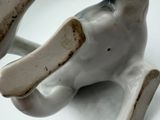 an elephant figurine that is sitting on a table
