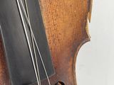 a close up of a violin that is on display