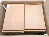 two boxes that are sitting in a box on a table