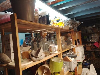 a shelf full of various items in a room