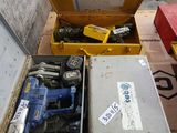 a box of tools sitting on the floor next to a box of tools