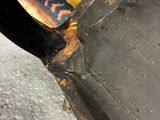 a close up of a black chair with a black seat
