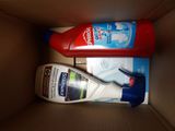 a bottle of toothpaste and a tube of toothpaste in a box