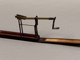 a miniature model of a plane on a wooden stand