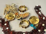 a lot of jewelry that is laying out on the table
