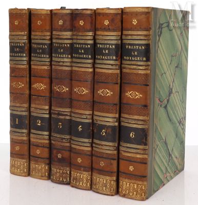 three books are stacked on top of each other on a white surface