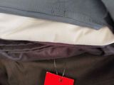 a close up of a pile of clothes with a red tag on it