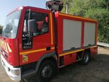 a red fire truck that is parked on the side of the road