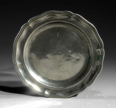 a silver plate that is sitting on a table