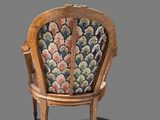 an image of a wooden chair with a colorful upholstered seat