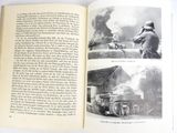 a book open to a page with pictures of military equipment
