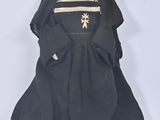 figurine of a woman dressed in black with a star on her head