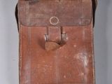 a small brown bag with a handle hanging from it ' s side