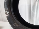 a tire that is sitting on a white table