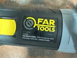 a close up of a cordless tool on a table