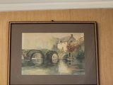 a picture of a painting on the wall above a fireplace