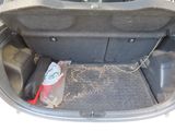 a trunk of a car that has a bag in it
