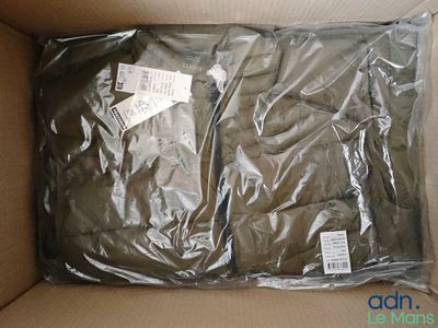 a box with a shirt inside of it on a table