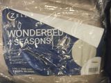 a plastic bag that has a blue and white sign on it