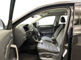 the interior of a car with the door open showing the driver ' s seat