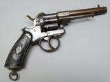 a gun that is sitting on top of a table