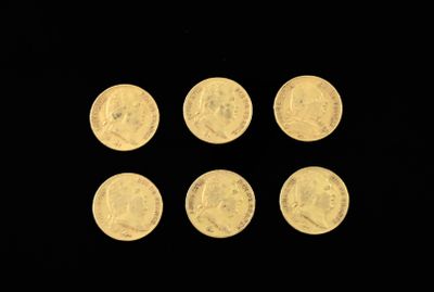 six gold coins are arranged in a row on a black background