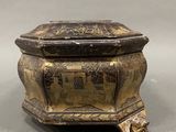 an antique brass box with a lid and a design on the lid