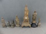 a lot of statues that are sitting on a table