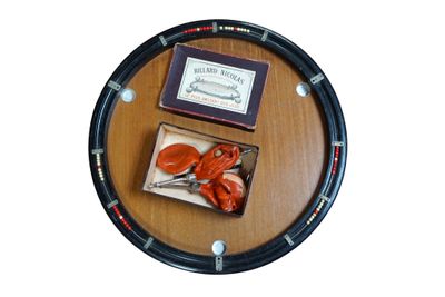 a picture of a clock with a box of scissors on it