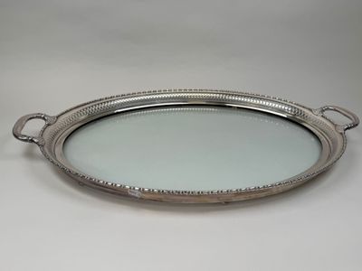 a silver tray with handles and handles on a white background