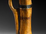 an old wooden beer mug sitting on top of a table