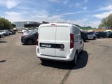 a white van that is parked in a parking lot